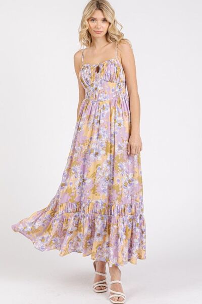 A fashionable front view of the Smocked Back Lavender Floral Print Maxi Cami Dress, showcasing a fitted bodice, soft floral tones, and an airy, relaxed fit ideal for warm days.