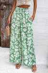 Model wearing Smocked Printed Wide Leg Pants styled for a casual, beach-ready look.
