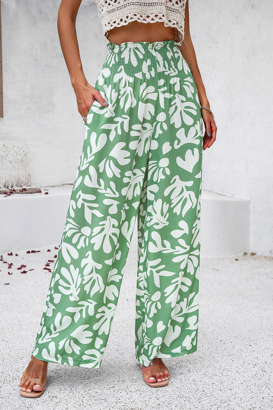 Side view of the Smocked green Printed Wide Leg Pants showing the flowy, relaxed fit.