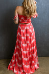 Back view of the Smocked Off-Shoulder Top and Slit Skirt Set, showcasing the floral design and ruffled sleeves.