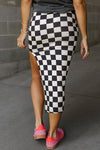 Back view of the Split Checkered Midi Skirt in black, highlighting the smooth finish and flattering fit of the skirt.