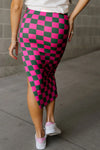 Back view of the Split Checkered Midi Skirt in hot pink, revealing the clean waistband and striking checkered print.