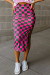 Front view of the Split Checkered Midi Skirt in hot pink, showcasing the bold checkered pattern and flattering fit.