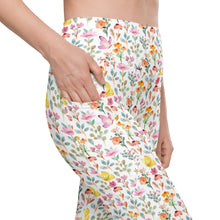  Closeup of white high waisted leggings featuring spring floral print with bees and butterflies. Compression leggings with side pocket for women.