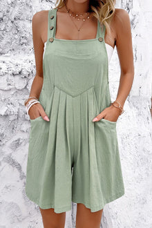  Model wearing Square Neck Wide Strap Overalls in sage green, featuring buttoned straps and functional pockets, styled casually for a relaxed look.

