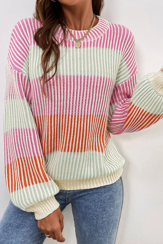 Model styled in the Striped Color Block Sweater with jeans and gold accessories for a chic winter look.