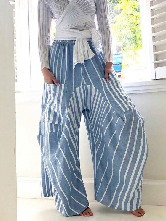 Stylish striped wide-leg pants with an elastic waistband, shown in blue and white, featuring functional pockets and a relaxed fit for casual outings.

