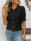  Front view of a stylish black lace shirt with button-down design and elegant see-through lace sleeves.