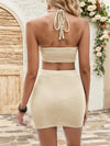Back view of the Tan Halter Neck Top and Skirt Set featuring an open-back design and tie detail.