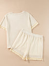 Front view of the Tassel Round Neck Top and Shorts Set featuring tassel details on the sleeves and shorts.