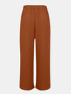 Back view of Full Size Tassel Wide Leg Pants, emphasizing the flowy silhouette and relaxed fit.