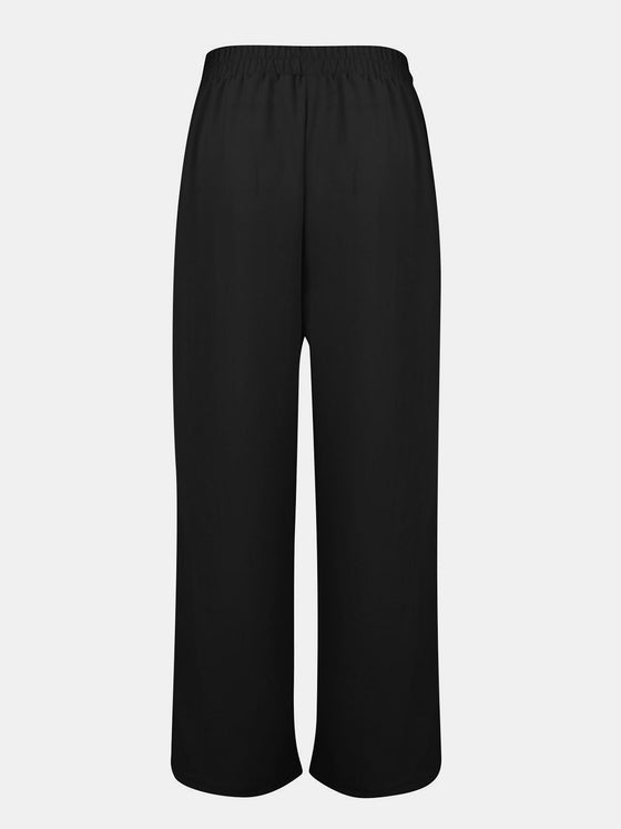 Back view of Full Size Tassel Wide Leg Pants, emphasizing the flowy silhouette and relaxed fit.