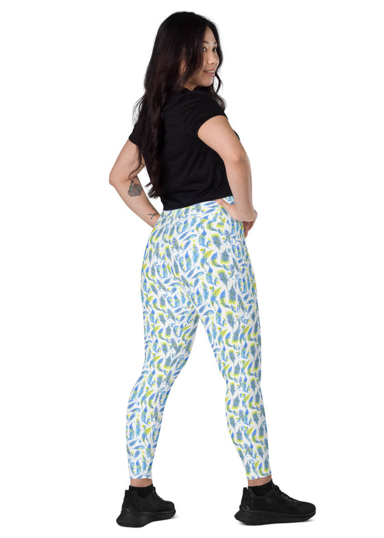 Activewear model wearing Teal Feather Print High-Waisted Yoga Leggings with pockets, demonstrating their stretch, compression, and stylish design for women’s fitness.