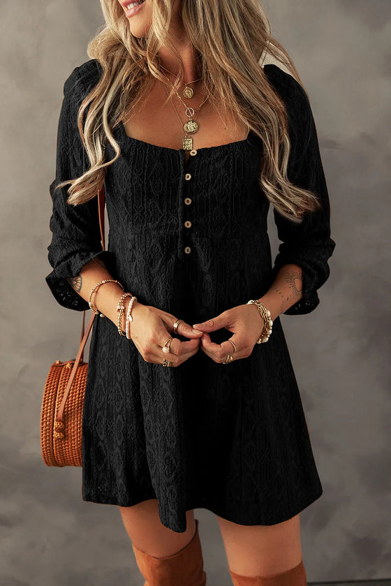 Close-up of a woman wearing a Textured Square Neck Mini Dress in earthy brown tones, styled with layered necklaces and a woven crossbody bag.

