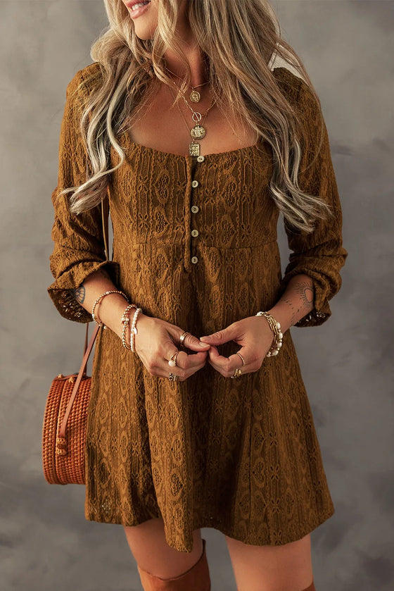 Close-up of a woman wearing a Textured Square Neck Mini Dress in earthy brown tones, styled with layered necklaces and a woven crossbody bag.