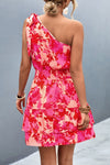 Back view of the Tied Smocked Printed Single Shoulder Dress highlighting the vibrant floral print.