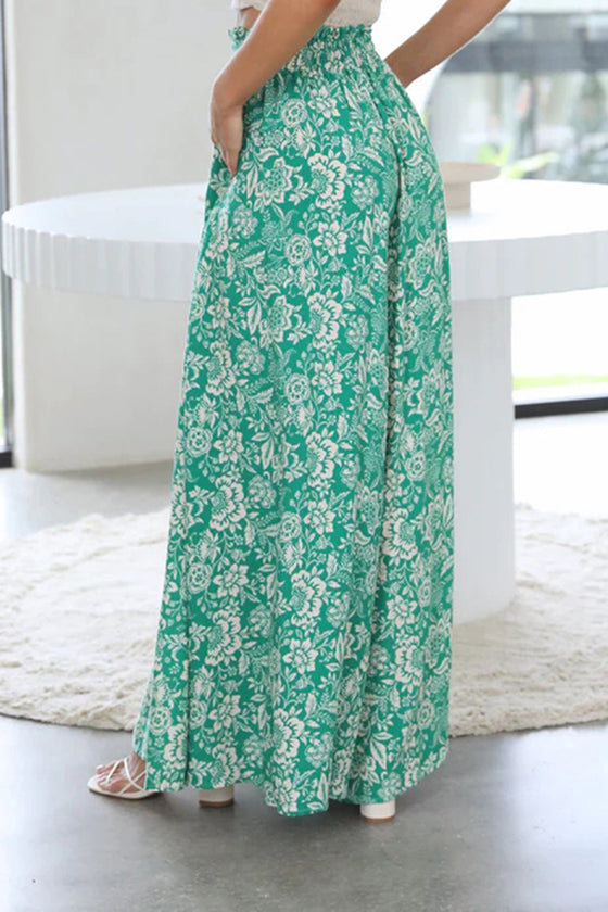 Side view of the Tied Wide Leg Pants showing the flowy, wide-leg cut and pocket detail.