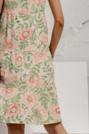 Side view of the Tiered Printed Round Neck Sleeveless Dress, highlighting its flowy silhouette and earthy tones.