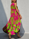 Back view of the Tiered Printed V-Neck Sleeveless Dress with colorful prints and a flowing tiered design.