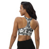 Model showing the back of a high support tiger print racerback sports bra. Seamless design with wide straps for gym and high impact workouts.