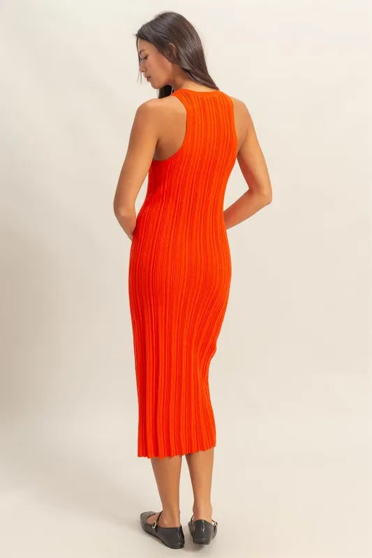 Back view of tomato red bodycon dress made with ribbed knit fabric—sleek and seamless design ideal for confident, flattering wear.