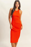 Woman wearing a tomato red ribbed knit bodycon dress in full front view—sleeveless, figure-hugging silhouette ideal for date nights, summer events, and clubwear.