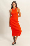 Full front image of a sleeveless tomato ribbed knit dress with scoop neckline and bodycon fit—bold and trendy outfit for casual glamour or weekend plans.