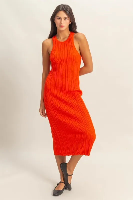Full front image of a sleeveless tomato ribbed knit dress with scoop neckline and bodycon fit—bold and trendy outfit for casual glamour or weekend plans.