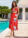 Model styled in the Twisted Printed Spaghetti Strap Top and Skirt Set at a poolside, exuding resort-chic vibes.