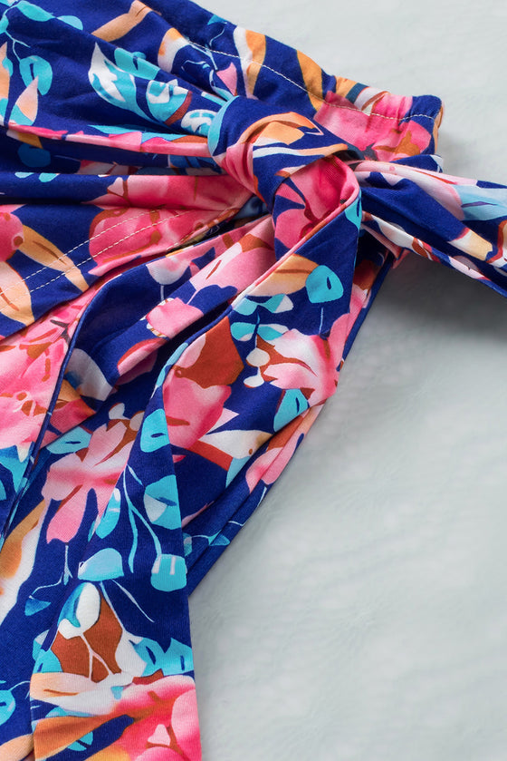 Close-up of the tie detail on the upper Floral Tied Mini Skirt, adding a chic touch.