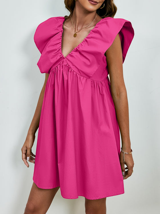 Side view of the V-Neck Cap Sleeve Mini Dress highlighting its elegant silhouette.