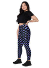 Woman standing while wearing Vibrant Neon Heart black high-waisted leggings with pockets, side view. Comfortable and stylish workout leggings for women with a tapered fit and bold neon heart print.