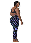 Back view of a plus-size woman wearing Vibrant Neon Heart black high-waisted leggings with pockets. Flattering and supportive gym leggings for women with a sleek, high-rise design and bold neon heart print.