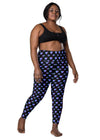 Plus-size woman wearing Vibrant Neon Heart black high-waisted leggings with pockets, front view. Comfortable and stylish workout leggings for women with a high-rise, compression fit and bold neon heart print.