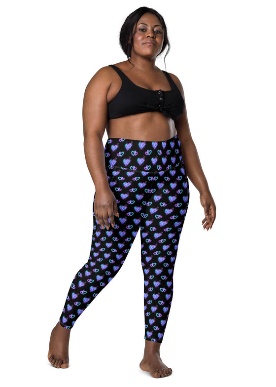 Plus-size woman wearing Vibrant Neon Heart black high-waisted leggings with pockets, front view. Comfortable and stylish workout leggings for women with a high-rise, compression fit and bold neon heart print.