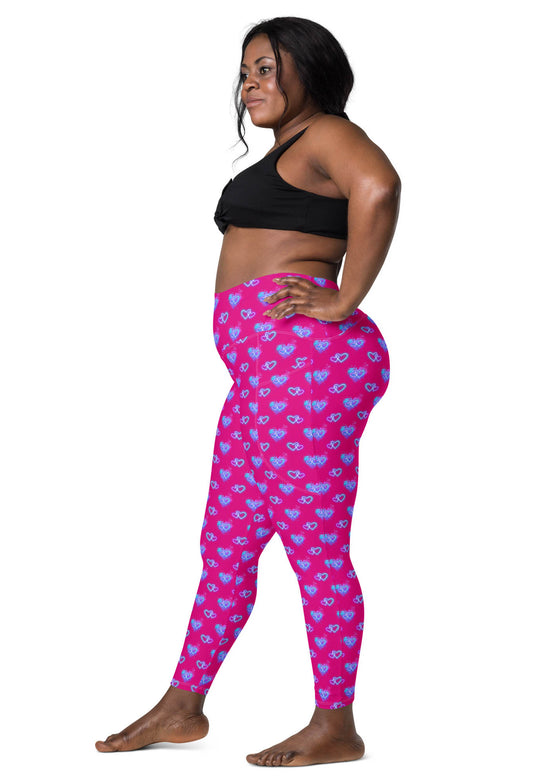 Side view of a plus-size woman wearing Vibrant Neon Heart violet-red high-waisted leggings with pockets. Perfect for yoga, gym, or casual wear. High-rise compression leggings with a tapered fit and bold neon heart print.