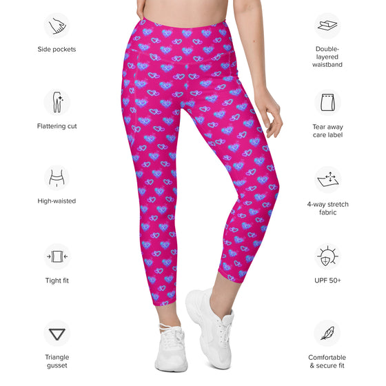 Text details of Vibrant Neon Heart violet-red high-waisted leggings with pockets. Features include high-rise compression, functional pockets, bold neon heart print, and a tapered fit. Perfect for workouts, yoga, or casual wear.