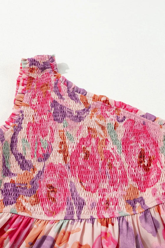 Detailed image capturing the shoulder seam and neckline design with rich texture and subtle floral accents on the pink fabric.

