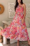 Graceful front-facing shot highlighting the one-shoulder design, cinched waist, and flowing silhouette with vibrant blooms.

