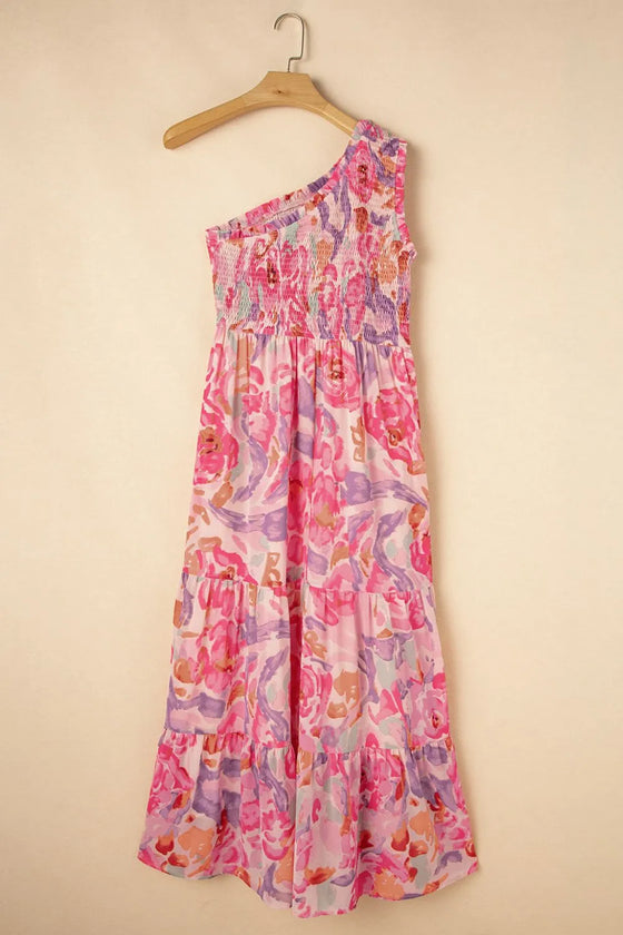 Closeup shot of the asymmetrical neckline showcasing the one-shoulder strap and delicate pleating near the bust.

