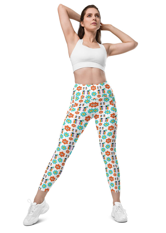 Model wearing white floral high waisted leggings with pockets, showcasing a flattering fit and elegant floral design. Ideal for yoga and gym workouts.