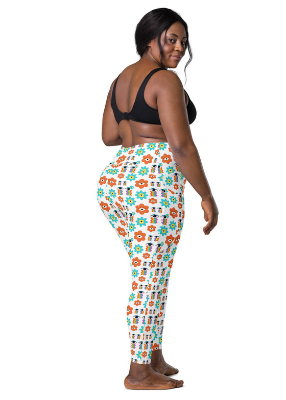 Plus-size model showing the back of white floral high waisted leggings with a secure waistband and functional pockets, offering a supportive and stylish fit.