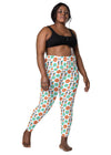 Plus-size woman wearing white floral high waisted leggings with pockets, featuring a tummy control fit and vibrant floral print for active and casual wear.