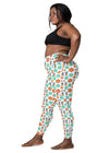 Close-up view of plus-size woman’s white floral high waisted leggings showcasing side pocket design. 