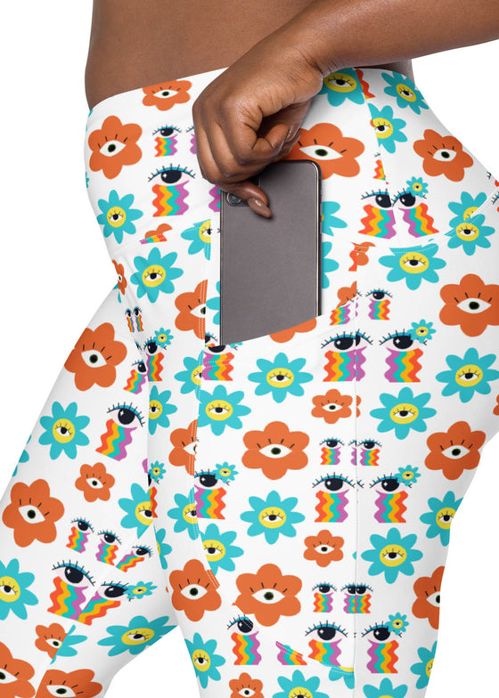 Close-up view of plus-size woman’s white floral high waisted leggings showcasing side pocket design. Perfect for carrying essentials while on the move.