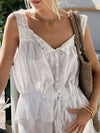 Front-angled front view showing the relaxed fit and lace neckline of the White Drawstring Tank.