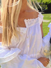 Close-up of the front neckline showing the lace detailing and soft fabric of the tank top.