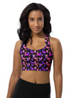 Woman wearing the Witchy Kitties Black Racerback Sports Bra. Featuring a mystical cat print, high-impact support, and a racerback fit for gym workouts and activewear.