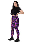 Side view of woman standing in Witchy Kitties Printed Black high-waist leggings with pockets. Chic and comfortable fit with a whimsical cat and moon design, ideal for lounging or workouts.
