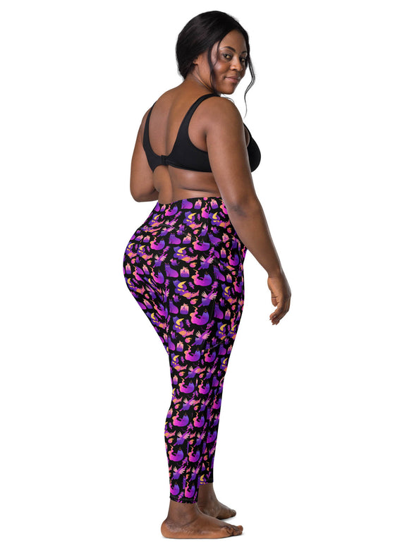 Plus-size woman wearing Witchy Kitties Printed Black high-waist leggings with pockets. Comfortable and flattering fit with a mystical cat and moon print, perfect for every body type.